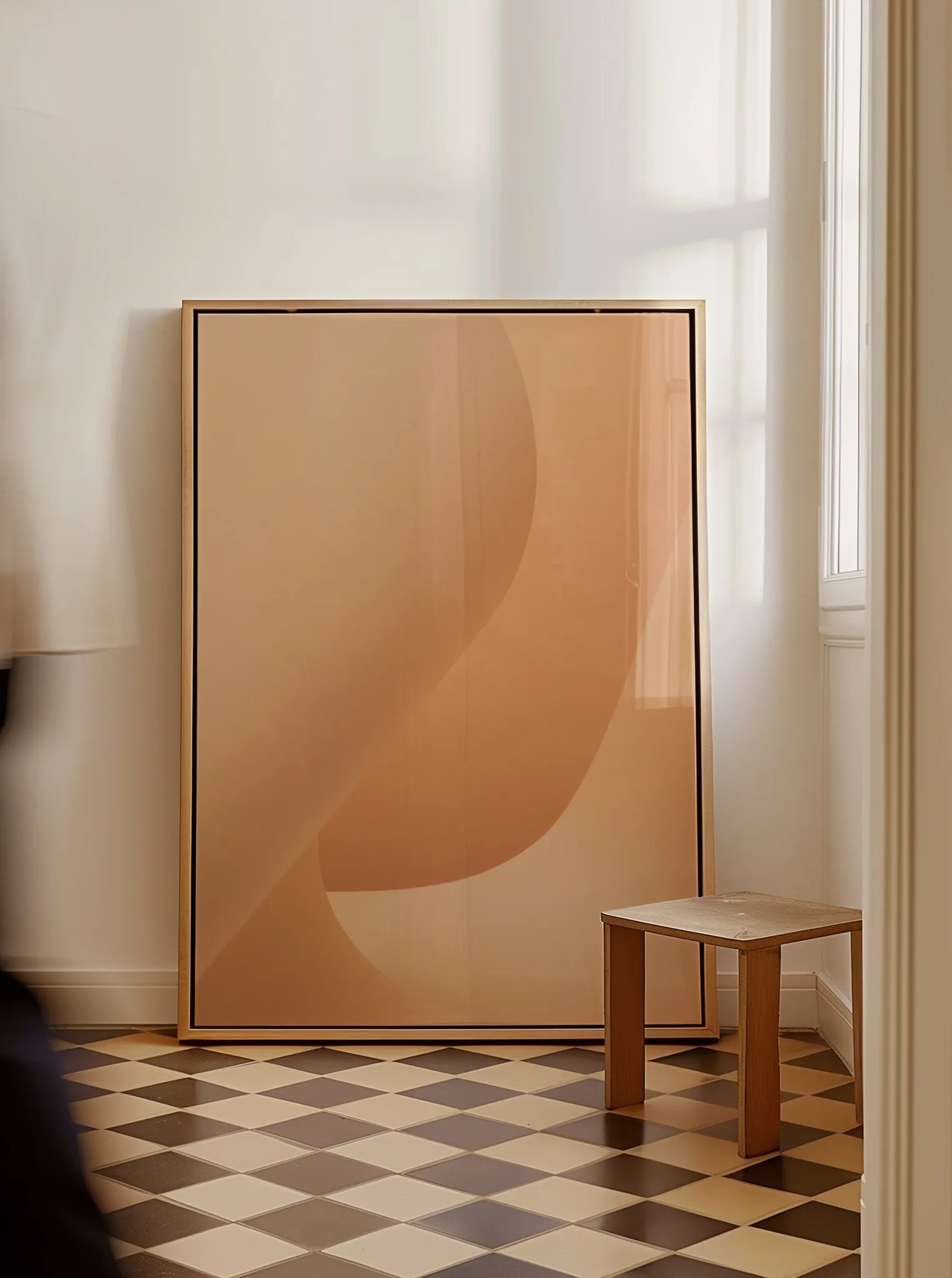 Framed fine art print “Beige Simplicity No.1” by Monday Gallery, styled in a warm minimalist interior with soft daylight and geometric floor tiles.