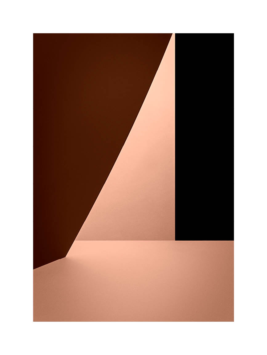 Minimalist fine art photograph in warm red and beige tones with geometric light and shadow composition. Printed in Sweden, exclusive at Monday Gallery.