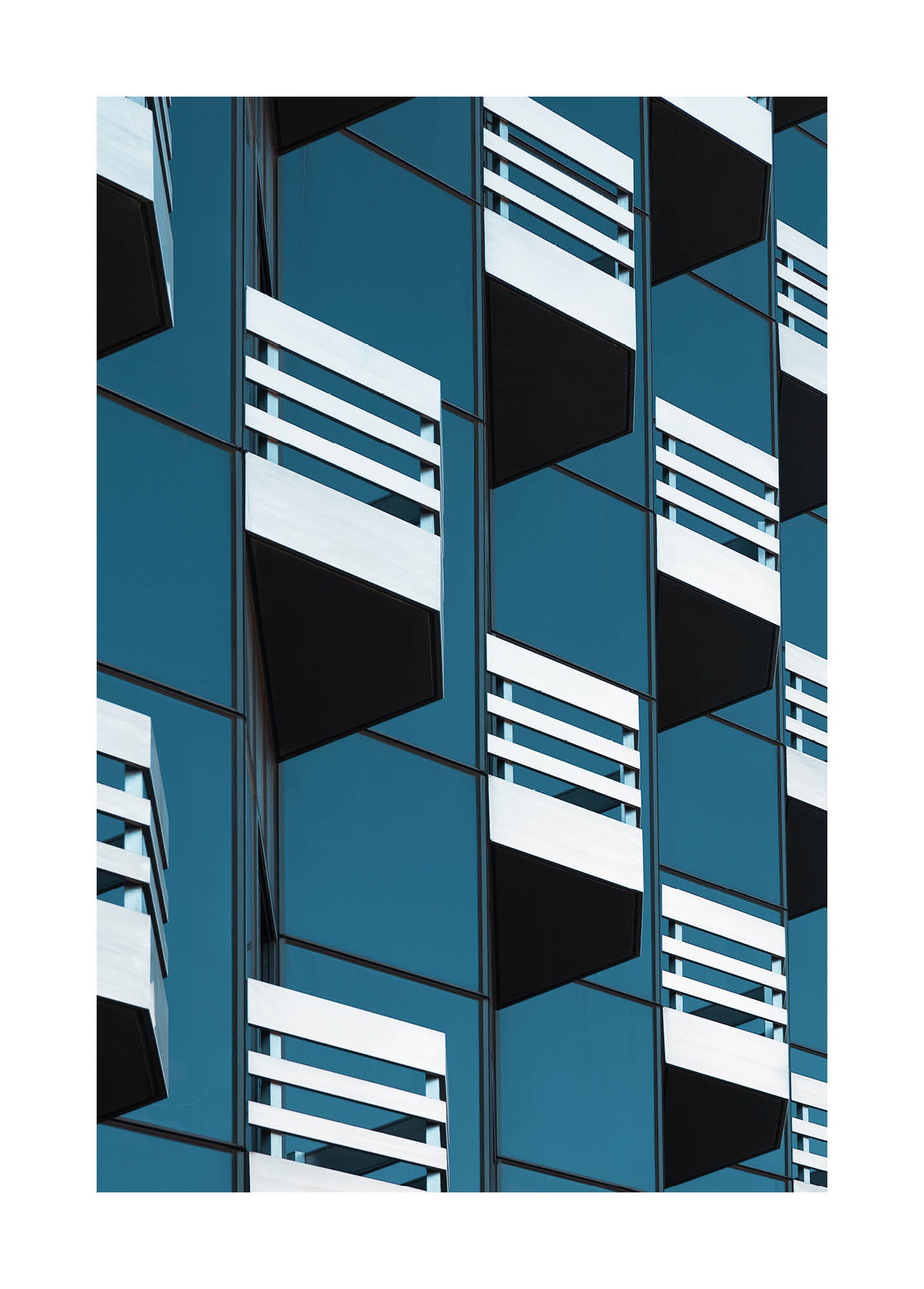Abstract fine art photograph of modern architecture with repeating balconies and geometric lines in blue and white. Printed in Sweden, exclusive at Monday Gallery.