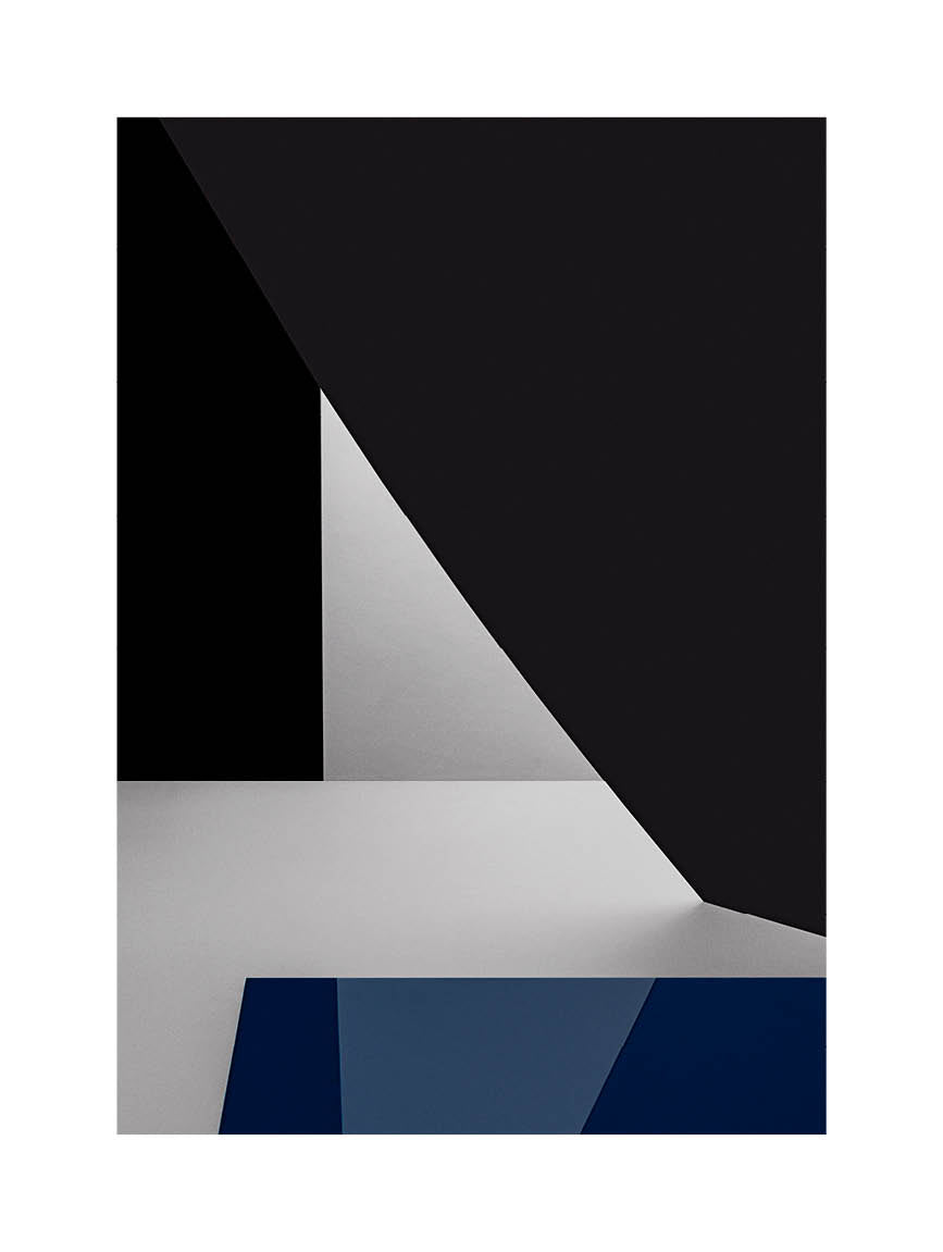 Minimalist fine art photograph in deep blue, white, and black geometric tones with architectural light and contrast. Printed in Sweden, exclusive at Monday Gallery.
