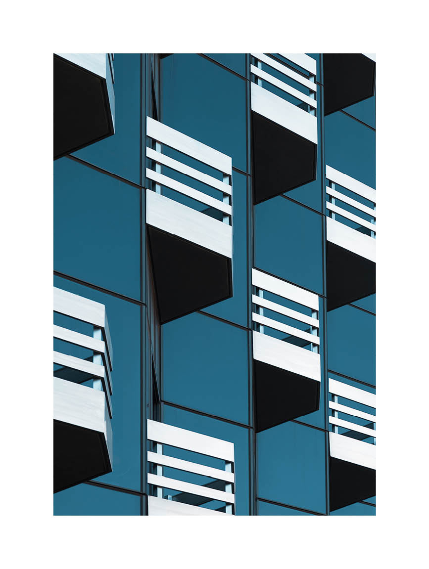  Abstract fine art photograph of modern architecture with repeating balconies and geometric lines in blue and white. Printed in Sweden, exclusive at Monday Gallery.