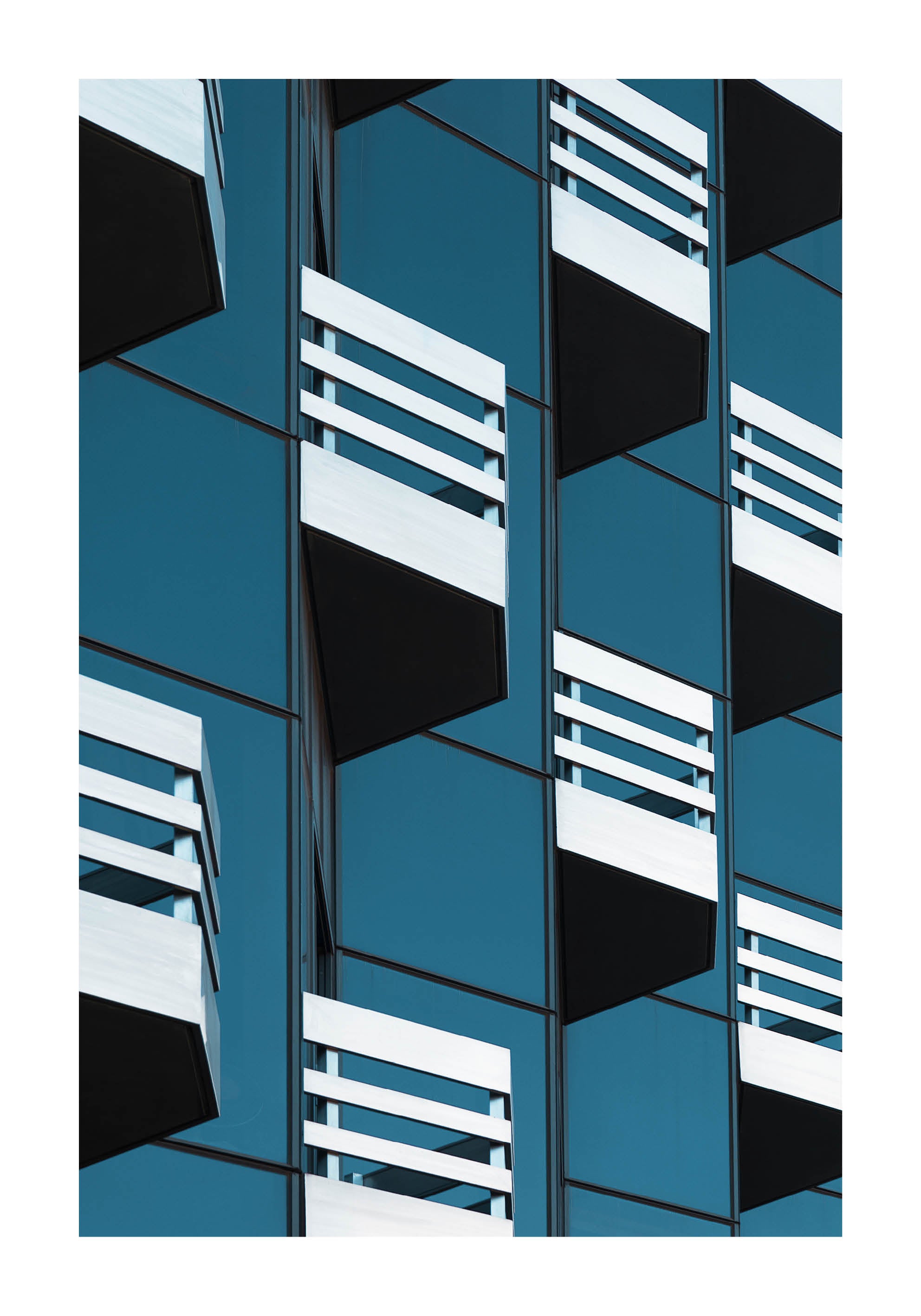  Abstract fine art photograph of modern architecture with repeating balconies and geometric lines in blue and white. Printed in Sweden, exclusive at Monday Gallery.